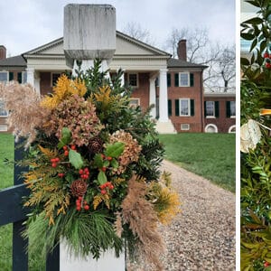 Three holiday wreaths with different decorations and ribbons are displayed, with a decorated fence post and a historic brick mansion in the background.