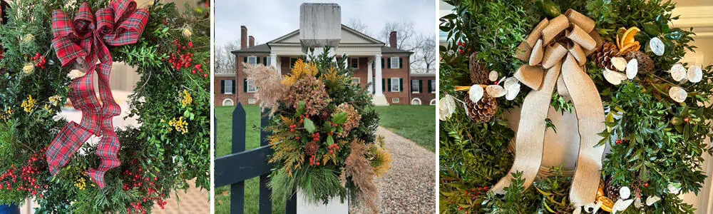 Three holiday wreaths with different decorations and ribbons are displayed, with a decorated fence post and a historic brick mansion in the background.