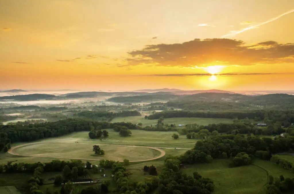 Sunrise over the rolling hills and forested landscape surrounding James Madison’s Montpelier estate in Orange County, Virginia